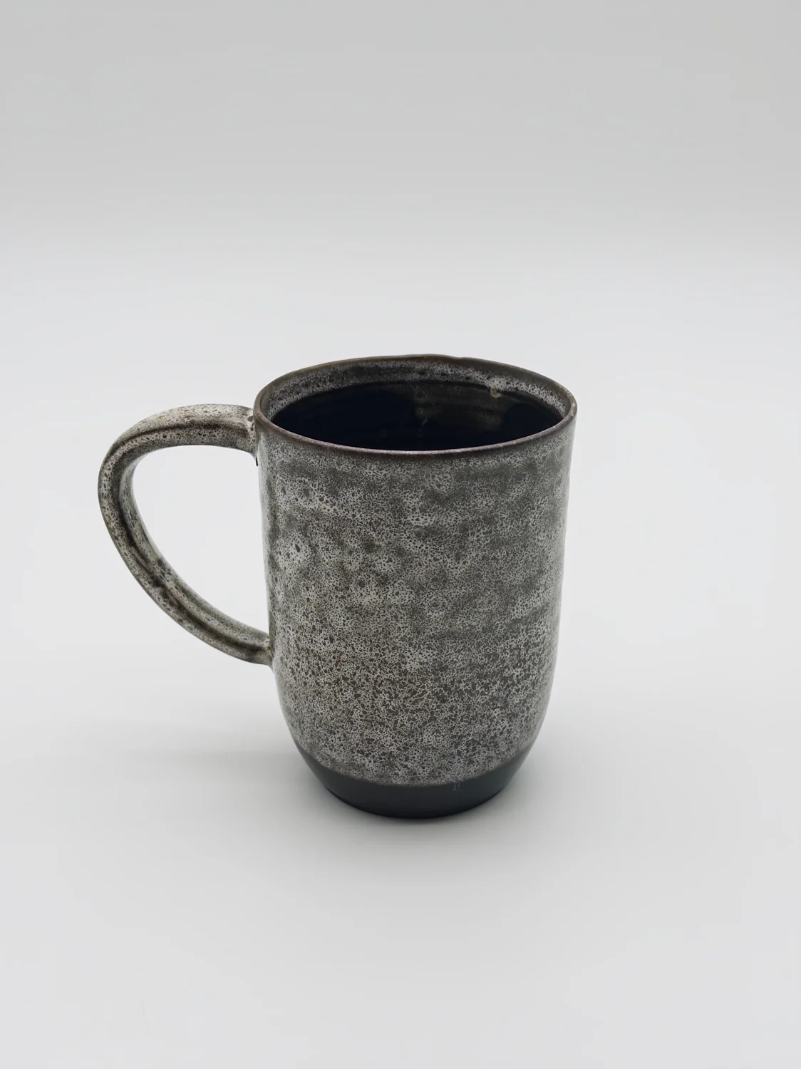 Mottled gray mug with a dark rim and interior